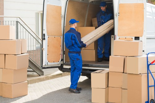 Office relocation planning in Brixton with packed boxes and office furniture