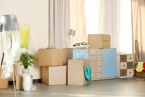 Removal van and moving team working on a Brixton residential street