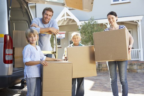 Unpacking boxes in a Brixton flat after a move