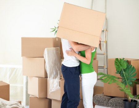 Mover handling household items during a residential removal job