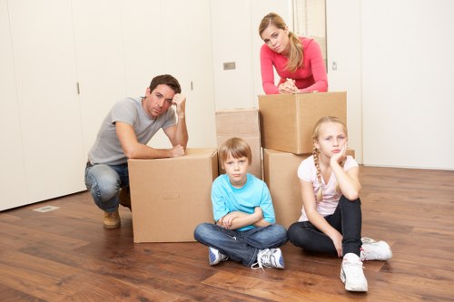 Packed moving boxes and furniture ready for local removals
