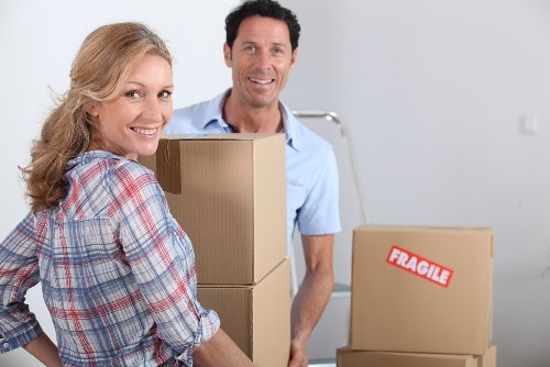 Careful loading of household items into a removal van for a Brixton move