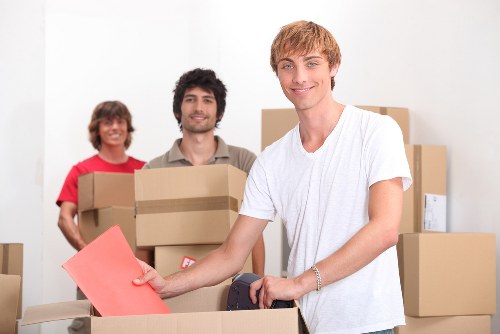 Packed office equipment ready for commercial move in Brixton