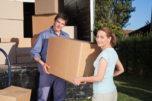 A Brixton removals service handling packed boxes with care and precision